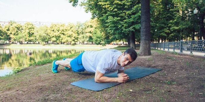 man doing plank for weight loss